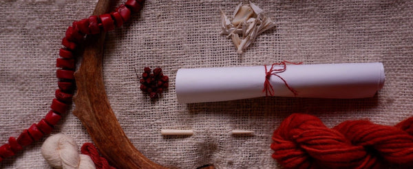 Woven wool altar cloth with red thread and bones